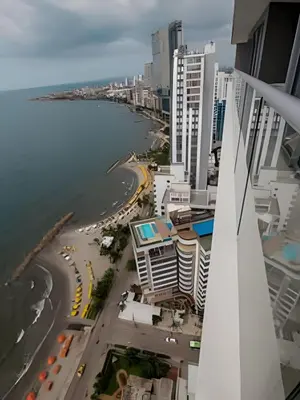 a view of the beach from the balcony of a building at Lujoso Apto de 1 habitacion en piso 29-Morros City in Cartagena de Indias