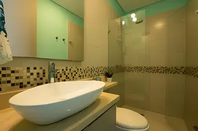 a bathroom with a large white sink and a toilet at Espectacular apt en el piso 29 en Palmetto Beach in Cartagena de Indias