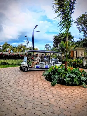 a man is sitting in a golf cart at Apartamento con vista al mar in Simón Bolivar