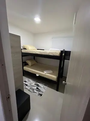 a small room with two bunk beds in it at Rent by days, 4th floor apartment in Cartagena de Indias