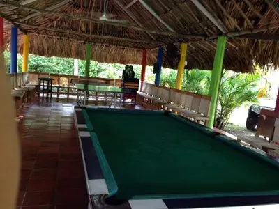 a pool table in the middle of a restaurant at Casafinca en Arjona # 3 in Cartagena de Indias