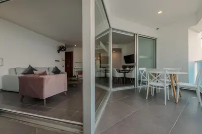 a living room with a couch and a table at Espectacular vista al mar - Infinito 2502 in Cartagena de Indias