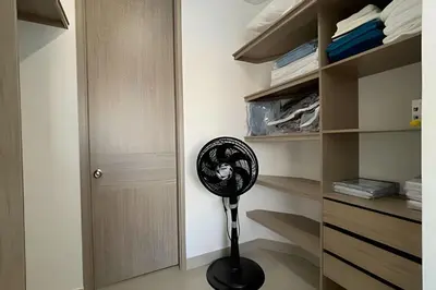 a black fan in a room with a closet at Infinitum Spectacular 23rd floor 1 BR Condo in Cartagena de Indias
