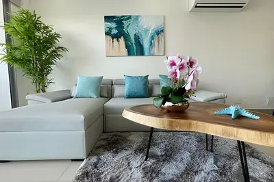 a living room with a couch and a table at Infinitum Spectacular 23rd floor 1 BR Condo in Cartagena de Indias