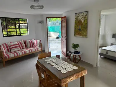 a living room with a table and a couch at Comfortable and quiet apartment in Cartagena de Indias