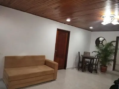 a living room with a couch and a table at Apartamento en Manga cerca al Centro Historico in Cartagena de Indias