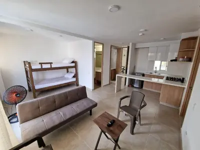 a living room with a couch and a bed at Apartamento en Cartagena, Manzanillo in La Siriaca