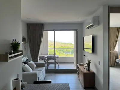 a living room with a couch and a table at Santa Marta apartamento con vista al mar- santamarina-709 in Santa Marta