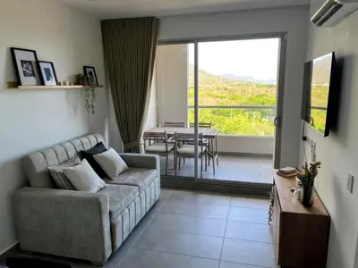 a living room with a couch and a table at Santa Marta apartamento con vista al mar- santamarina-709 in Santa Marta