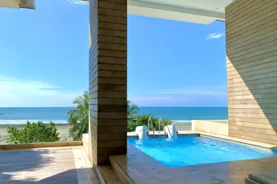 a view of the beach from a house with a swimming pool at by Calamari Homes - Murano Elite 1901 Bocagrande in Cartagena de Indias
