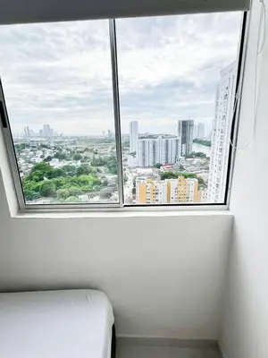 a window in a room with a view of a city at Moderno apto a pasos de la playa in Cartagena de Indias