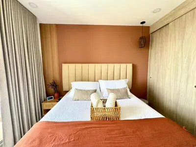 a bedroom with a large bed with a basket on it at Apartamento cerca al mar santa Marta- santamarina-614 in Santa Marta