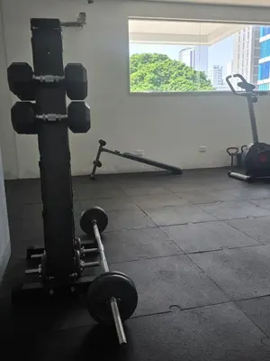 a gym with two dumbbells in a room at Stunning Bocagrande Beach Apartment in Cartagena de Indias