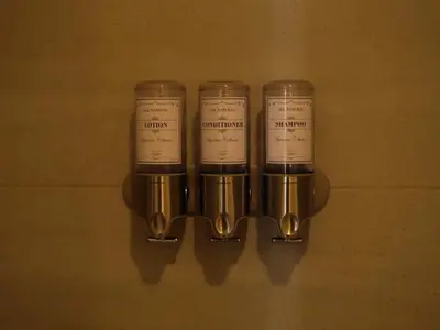 a group of four cups hanging on a wall at Santa Marta apartamento frente al mar -Santamarina- 1202 in Santa Marta