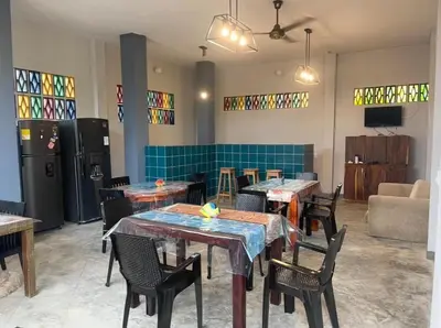 a restaurant with tables and chairs in a room at Apartaestudio Terraza del Sol 101 in Coveñas