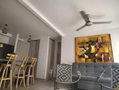a living room with a couch and a ceiling fan at Exclusive Caribbean Retreat Serena Del Mar in Cartagena de Indias