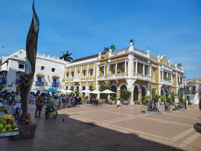 a group of people walking in a street in front of a building at Exclusive Caribbean Retreat Serena Del Mar in Cartagena de Indias