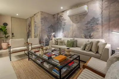 a living room with a couch and a table at Apt 3 Bedrooms SeaView AC Buenavista in Puerto Colombia