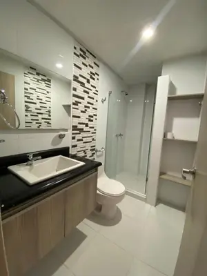 a bathroom with a toilet and a sink and a shower at Your ideal stay in Barranquilla awaits