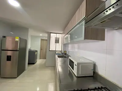 a kitchen with a microwave sitting on a counter at Your ideal stay in Barranquilla awaits