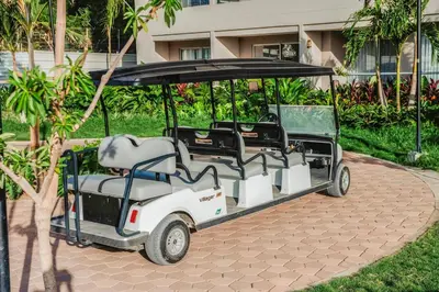 a golf cart is parked in a park at Apartment on the 21st floor, ocean and Sierra views in Simón Bolivar