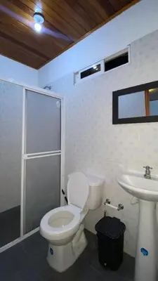 a bathroom with a toilet and a sink at GUILLOTE Comfort Loft in Cartagena de Indias