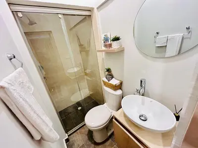 a bathroom with a toilet and a sink and a mirror at Hotel Casa Obed in Cartagena de Indias