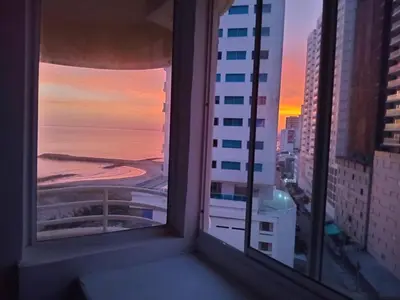 a view of the ocean from a window of a building at Oceanfront apartment in Cartagena de Indias