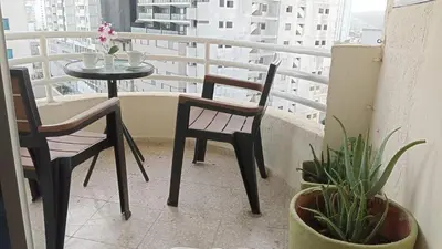 a balcony with a table and chairs on a balcony at Oceanfront apartment in Cartagena de Indias
