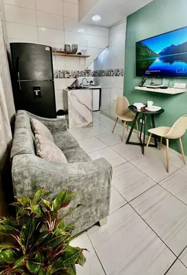 a living room with a couch and a table at GreenHeaven 101 Apto 2 Habitaciones Wifi Cocina AC in Barranquilla
