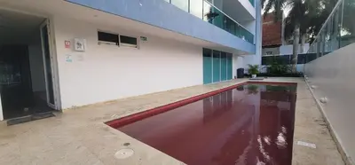 a swimming pool in front of a building at Live Stay - Boquilla Le Solei in Cartagena de Indias