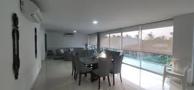 a dining room with a table and some chairs at Live Stay - Boquilla Le Solei in Cartagena de Indias