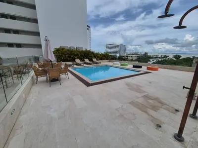 a swimming pool on the roof of a building at Olas & relax Cartagena in Cartagena de Indias