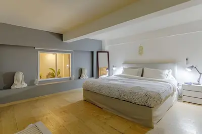 a bedroom with a large bed and a window at Luxury Duplex Retreat, Aldaba Selection in Cartagena de Indias