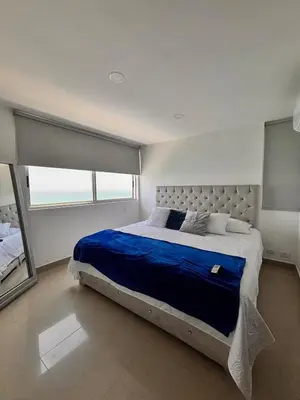 a bedroom with a large bed and a large window at Apartment in Cartagena 5 minutes from the historic center in Cartagena de Indias