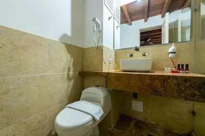 a bathroom with a toilet and a sink at Apartamento Virrey in Cartagena de Indias