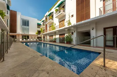 a swimming pool in the middle of a building at Apartamento Virrey in Cartagena de Indias