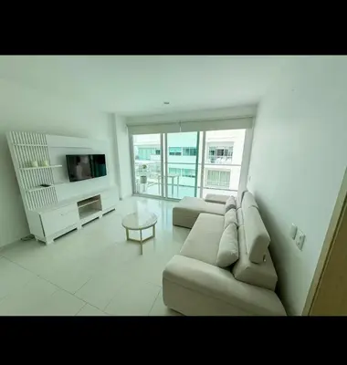 a living room with a couch and a tv at Modern and comfortable in Cartagena de Indias