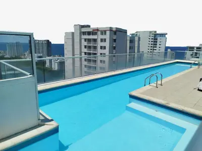 a swimming pool on the roof of a building at Beach Veronica Luxury Ocean View Apartment in Cartagena de Indias
