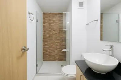 a bathroom with a sink and a toilet and a shower at Beach Veronica Luxury Ocean View Apartment in Cartagena de Indias