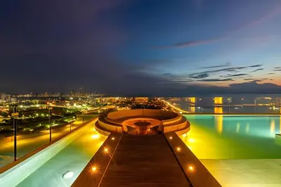 a view of a building with a pool at night at New Murano Centro/Near Walled City/Panoramic Pool in Cartagena de Indias