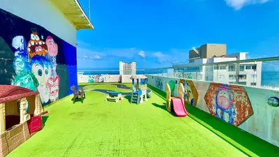a balcony with a mural on the side of a building at Apartamento en Cartagena cerca al mar in Cartagena de Indias