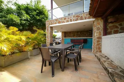 a patio with a table and chairs on a patio at Casa Juliana vista al mar piscina y jacuzzi in Tubará