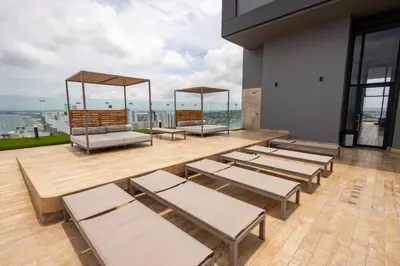 a group of lounge chairs on a patio with a view at Loft cercano al Centro Histórico-Cartagena in Cartagena de Indias