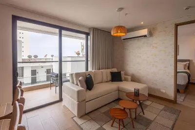 a living room with a couch and a balcony at Loft cercano al Centro Histórico-Cartagena in Cartagena de Indias