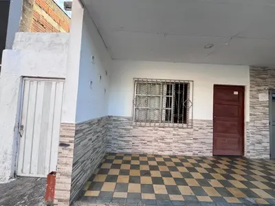 an empty room with a window and a checkered floor at CasaMartina in Cartagena de Indias