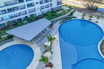 an overhead view of two swimming pools in a building at Apartamentos Exclusivos Santa Marina - AR Rentals in Santa Marta