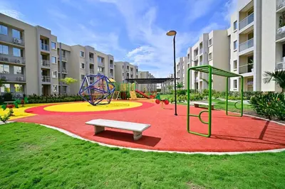 a playground with a bench and a swing at Apartamento en Cartagena elegante con piscina in Manzanillo del Mar