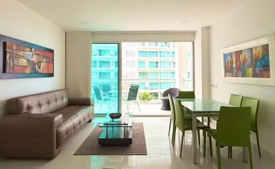 a living room with a couch and a glass table at Morros 3, Beachfront & 2 Bedrooms in Cartagena de Indias