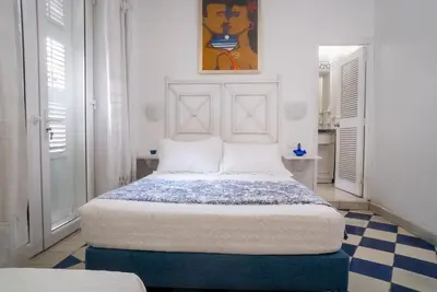 a white bedroom with a bed in a room at Boutique Colonial en el Centro Histórico in Cartagena de Indias
